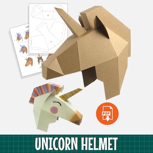 May include: A low-poly unicorn helmet made of brown cardboard, a smaller assembled unicorn head with a colorful mane and horn, and printed paper templates. An orange circular icon with a white PDF download symbol is visible on the right side.