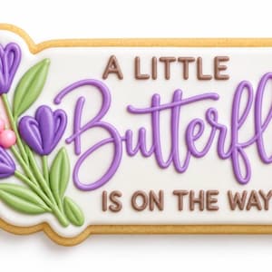 May include: A rectangular sugar cookie with white icing featuring the purple text A LITTLE BUTTERFLY IS ON THE WAY. The design includes purple tulip-like flowers, green leaves, and small pink round accents on the left side of the cookie.