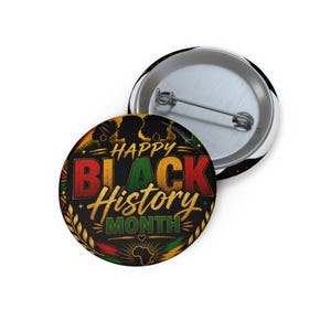 May include: A round pin-back button featuring the text Happy Black History Month in red, green, and gold lettering. The design includes silhouettes of people, a map of Africa, and decorative laurel leaves on a black background with a metal pin.