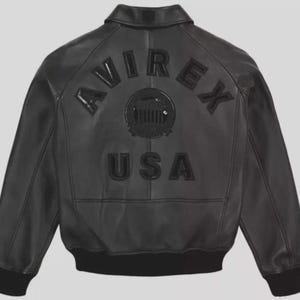 May include: Black leather bomber jacket with the word "AVIREX" arched across the back, above a circular emblem and the word "USA". The jacket has a ribbed collar, cuffs, and hem. A classic outerwear piece.