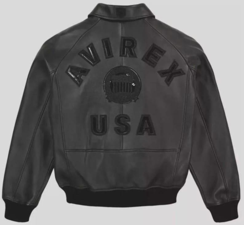 May include: Black leather bomber jacket with the word "AVIREX" arched across the back, above a circular emblem and the word "USA". The jacket has a ribbed collar, cuffs, and hem. A classic outerwear piece.