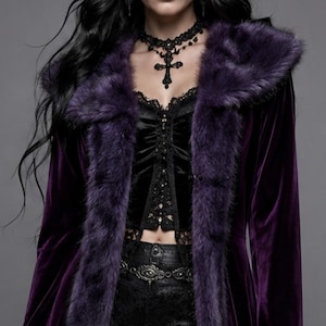 May include: A deep purple velvet coat featuring a plush faux fur trim along the hood, front opening, and sleeve cuffs. The coat is worn over a black lace-up corset top and black lace shorts, complemented by a black lace choker with a cross pendant.
