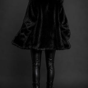 May include: A black faux fur coat with a wide collar, paired with black leather-look trousers and black platform boots featuring multiple buckle straps. The ensemble is entirely black, showcasing a textured coat and smooth, fitted pants.