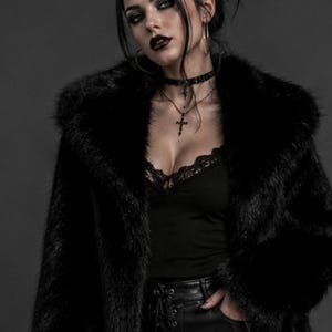 May include: A black faux fur coat worn over a black camisole with lace trim, paired with black leather-look pants featuring a front lace-up detail. The outfit is accessorized with a black choker and a necklace featuring a cross pendant.