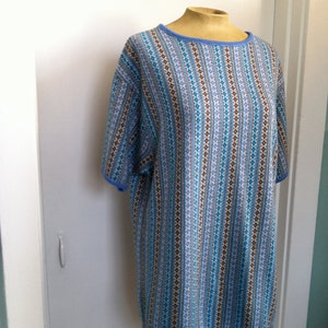 May include: A blue and brown striped knit top with a round neckline and short sleeves. The top has a blue trim around the neckline and sleeves.