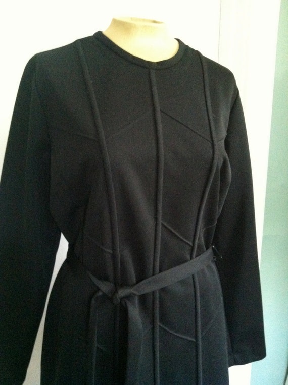 belted black dress / chevron detailing