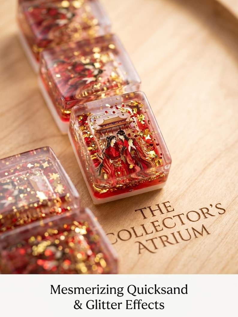 May include: A set of rectangular resin tiles featuring a clear top layer filled with red liquid, gold glitter, and a miniature illustration of two figures in traditional red robes standing before a building. The text THE COLLECTOR'S ATRIUM is visible.