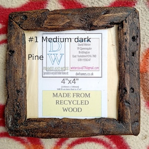 May include: A square picture frame crafted from dark, textured recycled pine wood. The center insert displays the text #1 Medium dark Pine, DW FRAMES AND MORE, 4"x4", [100mm x 100mm], and MADE FROM RECYCLED WOOD, along with contact details for David Winter.
