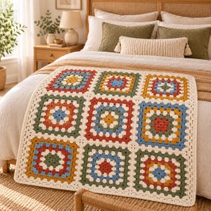 May include: A handmade crochet blanket featuring a grid of nine square motifs. Each square is composed of concentric rounds in alternating colours including mustard yellow, sage green, terracotta red, light blue, and cream white yarn.