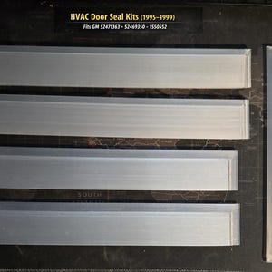 May include: An HVAC door seal kit for 1995-1999 GM vehicles, including four long rectangular translucent seals, two narrow vertical strips, and five small circular washers. The text reads: HVAC Door Seal Kits (1995-1999) Fits GM 52471363 - 52469350 - 1550552.
