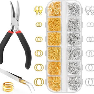 May include: A set of jewelry making tools including curved-nose pliers with black handles and red accents, silver-tone tweezers, a gold-tone ring tool, and a clear plastic organizer box filled with assorted gold and silver jump rings and clasps.