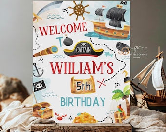 May include: A white printable sign with a pirate theme. The sign says "Welcome to William's 5th Birthday". The sign has a treasure map design with a pirate ship, a treasure chest, and a cannon.