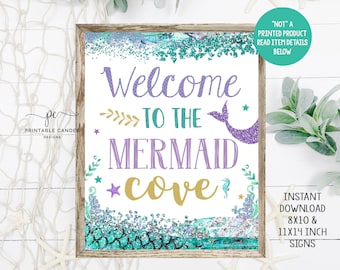 May include: Printable sign with a mermaid tail and the text "Welcome to the Mermaid Cove" in gold and purple lettering. The background is a blue and green glitter design with a mermaid scale pattern.