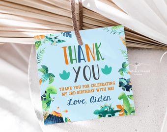 May include: Blue thank you tag with a dinosaur theme. The tag says "Thank you for celebrating my 3rd birthday with me! Love, Aiden".