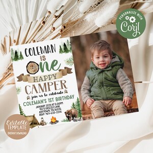 May include: A printable invitation for a first birthday party with a woodland camping theme. The invitation features a photo of a young boy, a bear, a campfire, and a tent. The text on the invitation reads "Coleman is One Happy Camper" and includes details about the party, such as the date, time, and location.