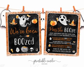 May include: Two printable Halloween signs featuring a ghost with a witch's hat and a cauldron. The text on the signs reads "We've been Boozed" and "Pass the Booze".