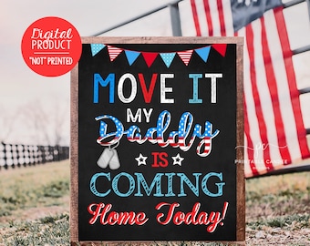 May include: A chalkboard sign with a red, white, and blue American flag theme. The sign says "Move It My Daddy Is Coming Home Today!" with a pair of dog tags and stars.