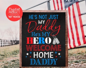 May include: A black chalkboard sign with white text that reads "He's not just my Daddy, He's my HERO Welcome Home DADDY". The text is in red, white, and blue, and there are two silver dog tags hanging from the word "HERO".