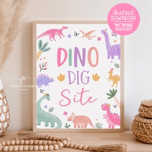 May include: Printable sign with the text "Dino Dig Site" in pink, purple, and green letters. The sign is decorated with cartoon dinosaurs and flowers.