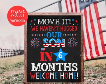 May include: A chalkboard sign with a red, white, and blue patriotic theme announcing the arrival of a baby boy in 6 months. The sign reads "Move it! We haven't hugged our son in 6 months. Welcome home!"