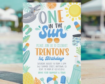 May include: A blue and yellow birthday invitation with the text "One in the Sun" and "Trenton's 1st Birthday". The invitation features a variety of summer-themed illustrations, including a shark, a pineapple, a beach umbrella, and a pair of sunglasses.