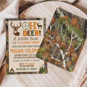 May include: A baby shower invitation with a camouflage background. The text reads "Oh Deer! A Little Buck is Almost Here!" with a deer silhouette and a target symbol. The invitation includes the name "Megan Coleman", the date and time of the shower, the address, and the RSVP information.