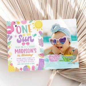 May include: A colorful invitation for a first birthday party with a summer theme. The invitation features a flamingo, a sun, and the text "One in the Sun". It also includes the name "Madison's" and the date and time of the party. The invitation is decorated with various summer-themed elements, such as watermelon, ice cream, and palm trees.