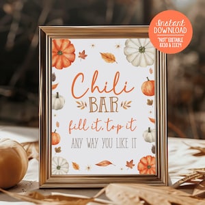 May include: A printable sign with a gold frame and a white background. The sign says "Chili Bar fill it. top it ANY WAY YOU LIKE IT". The sign is decorated with fall-themed illustrations of pumpkins, leaves, and flowers.