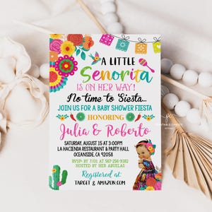 May include: A colorful baby shower invitation with the text "A Little Senorita is on Her Way!" and "Join us for a Baby Shower Fiesta." The invitation features floral and cactus illustrations, with the names Julia & Roberto. The event is on August 15.