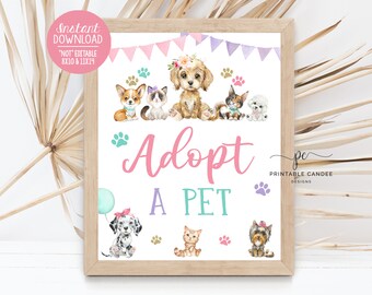May include: Printable sign with the text "Adopt a Pet" in pink and teal lettering. The sign features a variety of cartoon animals, including dogs and cats, with a pink, purple, and teal color scheme.