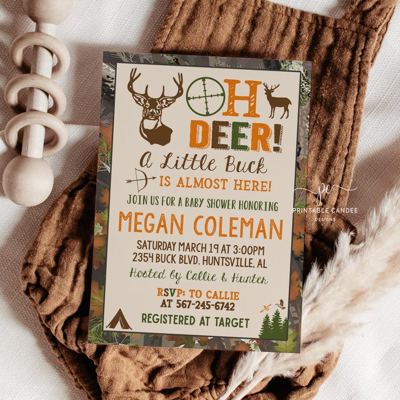 May include: A baby shower invitation with a camouflage background. The invitation features a deer with antlers and the text "Oh Deer! A Little Buck is Almost Here!"  The invitation also includes the name "Megan Coleman", the date and time of the shower, the address, and the names of the hosts.