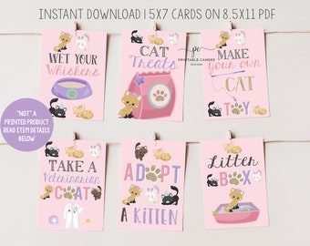 May include: A series of pink printable cards with cat illustrations and text. The cards feature phrases such as "Wet Your Whiskers," "Cat Treats," and "Adopt a Kitten." Each card has a different cat graphic.