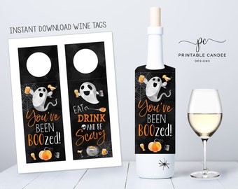 May include: Two printable wine bottle tags featuring a ghost with the text "You've Been Boozed!" and "Eat, Drink and Be Scary".