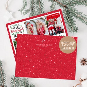 May include: A red Christmas card with a white snowflake pattern. The front of the card features a photo collage of two girls in winter clothing. The text on the card reads "It's the most wonderful time of the year". The back of the card has the text "Printable Candee Designs" and "Front and Backside Included".