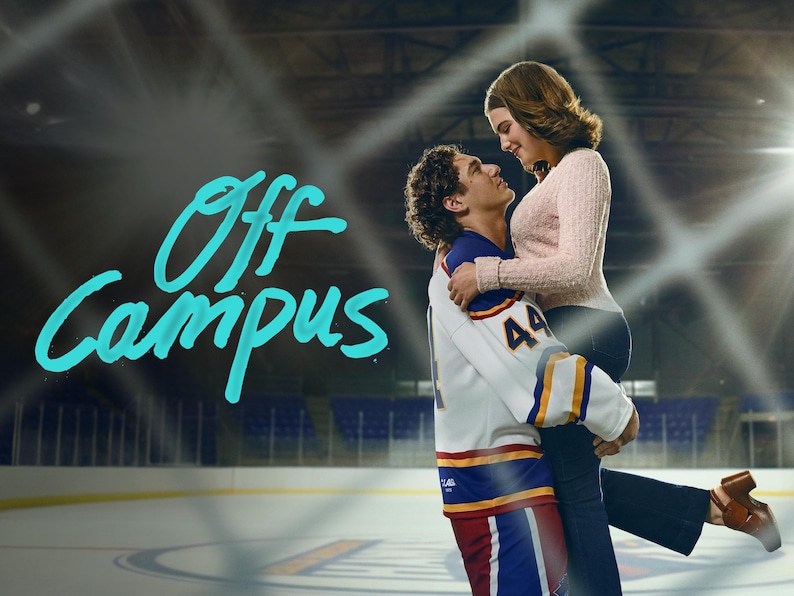 May include: A couple embraces on an ice rink. The man wears a white hockey jersey with blue and gold accents and the number 44. The woman wears a pink sweater and dark pants. The words "Off Campus" are written in teal.