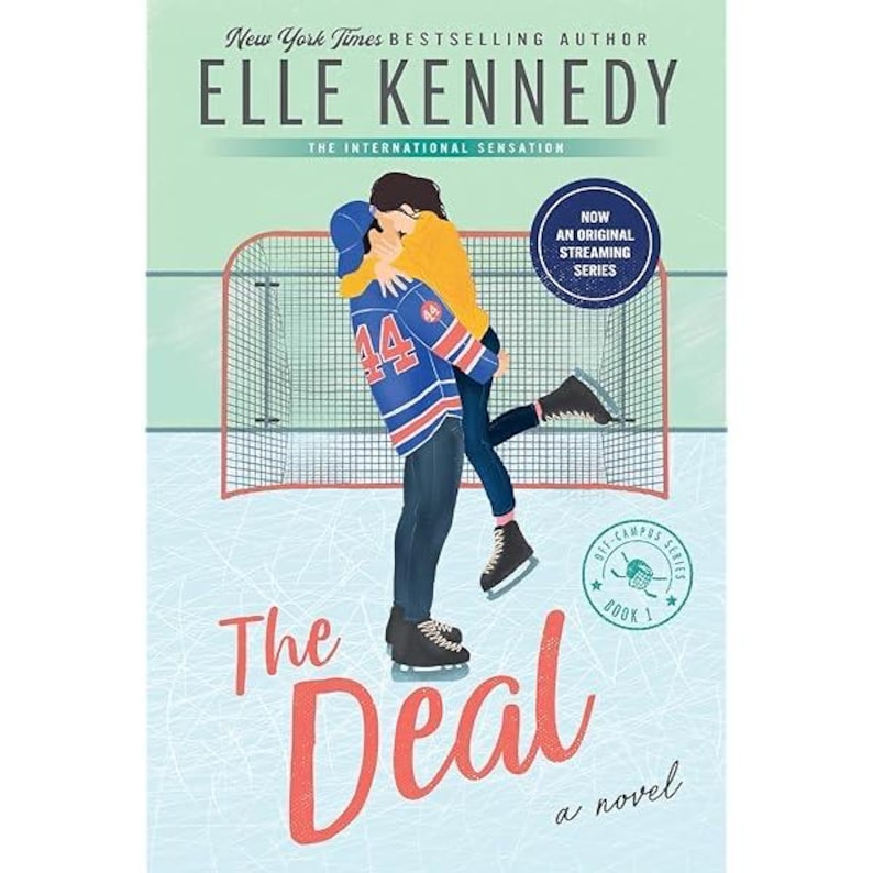 May include: Book cover for "The Deal" by Elle Kennedy. The cover features a couple embracing on an ice rink, with a hockey net in the background. Text includes the author's name, book title, and "Now an Original Streaming Series."