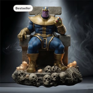 May include: A detailed statue of Thanos seated on a stone throne, wearing blue and gold armor, and the Infinity Gauntlet. The base features skulls and candles. The word "Bestseller" is in a white oval in the top left corner.