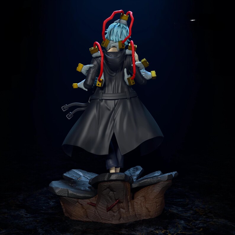 May include: A detailed figurine of a character from the anime series My Hero Academia. The figure is of a character with light blue hair, wearing a black coat, and multiple detached hands. The figure is standing on a detailed base.