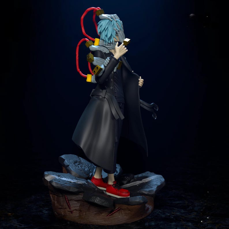 May include: A detailed figurine of a character with pale blue hair, wearing a black coat and red sneakers. The figure has a mask and a complex apparatus with red tubes and yellow accents. The figure is standing on a rocky base.