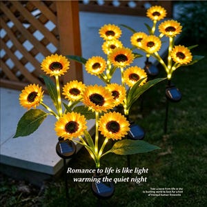 May include: Solar-powered sunflower garden lights. The yellow and orange flowers have a dark center and green leaves. The lights are on black stakes with solar panels. Text on the image reads: "Romance to life is like light warming the quiet night."