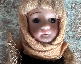 Antique Bisque Porcelain Doll with glass eyes and Papier marche body