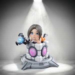 May include: A stylized figurine of a character with brown hair and blue eyes, resting on a white cube featuring pink heart symbols. The character holds a black mechanical device with a glowing blue center, all mounted on a gray circular base.