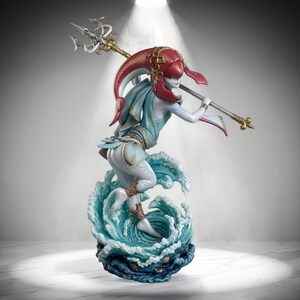 May include: A fantasy figurine of a pale-skinned humanoid figure with a red headpiece, wearing light blue and gold clothing, holding a silver trident. The figure stands atop a sculpted base of swirling blue ocean waves with small seashells.