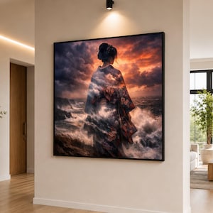 May include: A framed art print depicts a woman in a kimono standing before a stormy sea. The artwork features a dramatic sky with orange and gray clouds. The woman's kimono has floral patterns, and the waves are crashing against the shore.