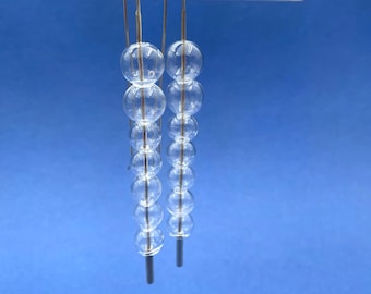 LONG tapered STACK of seven clear glass bubbles .  French hook earrings in sterling silver