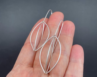 silver SEED POD earrings . modern minimal botanical jewelry . floral silhouette dangles
