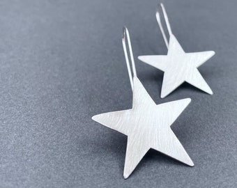large SILVER STAR earrings . SPARKLE big star dangle earrings . shooting star french hooks . Make A Statement . Be Bold . Be You