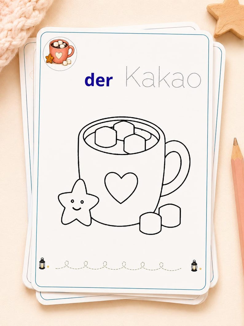 K&ouml;nnte beinhalten: Eine wei&szlig;e, rechteckige Lernkarte mit einer schwarzen Strichzeichnung einer Tasse voller Marshmallows, einem Herzsymbol und einem l&auml;chelnden sternf&ouml;rmigen Keks. Der Text lautet der Kakao, wobei der in Blau und Kakao in gepunkteter Schrift ist.