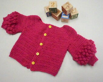 Electric pink crochet baby cardigan
