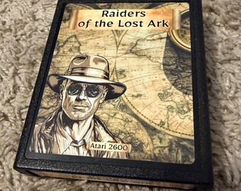 Vintage Raiders of the Lost Ark cartridge for Atari 2600 with modernized original labels.